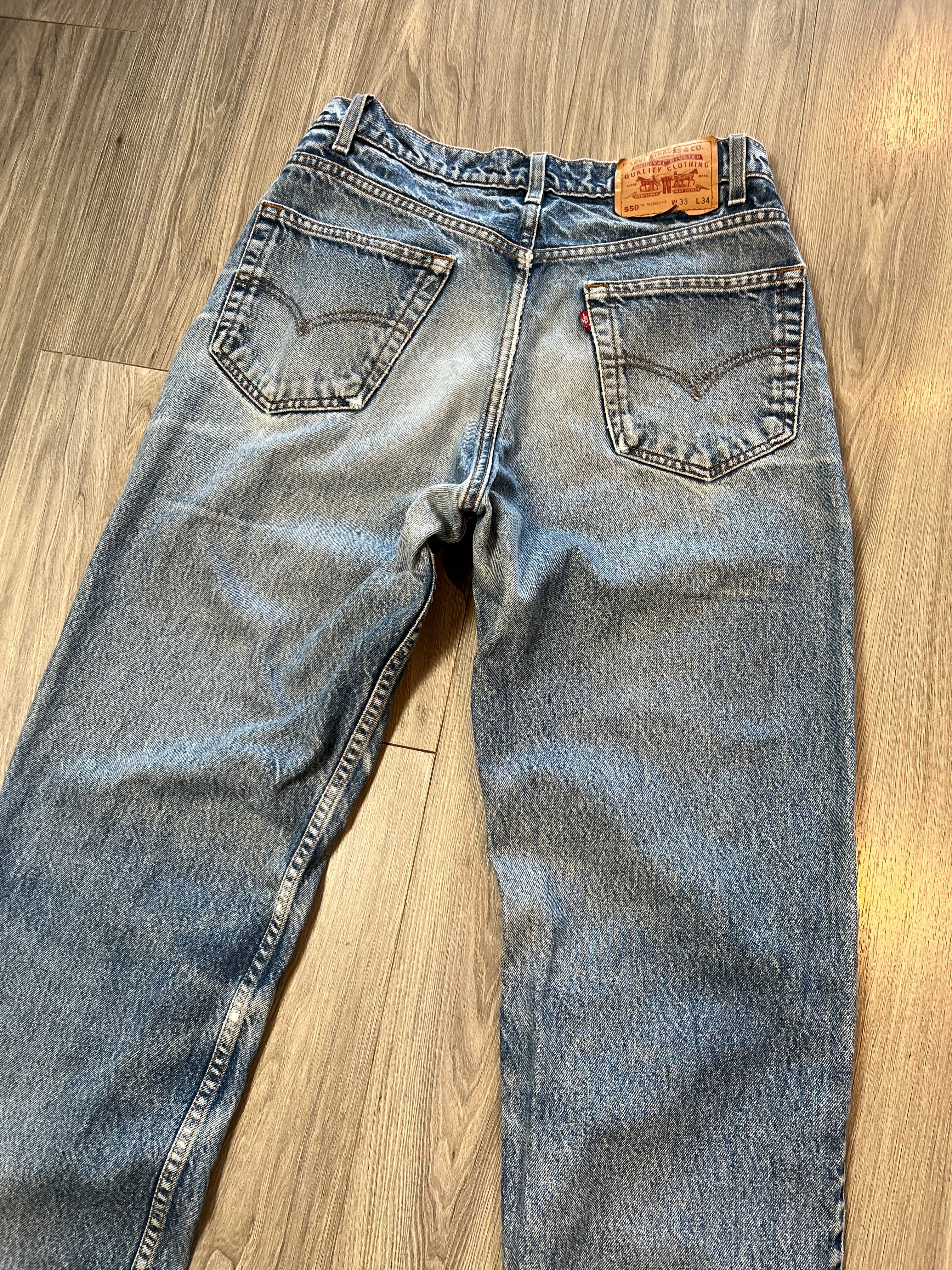 Vintage Levi's 550 Medium Wash Distressed Denim 31