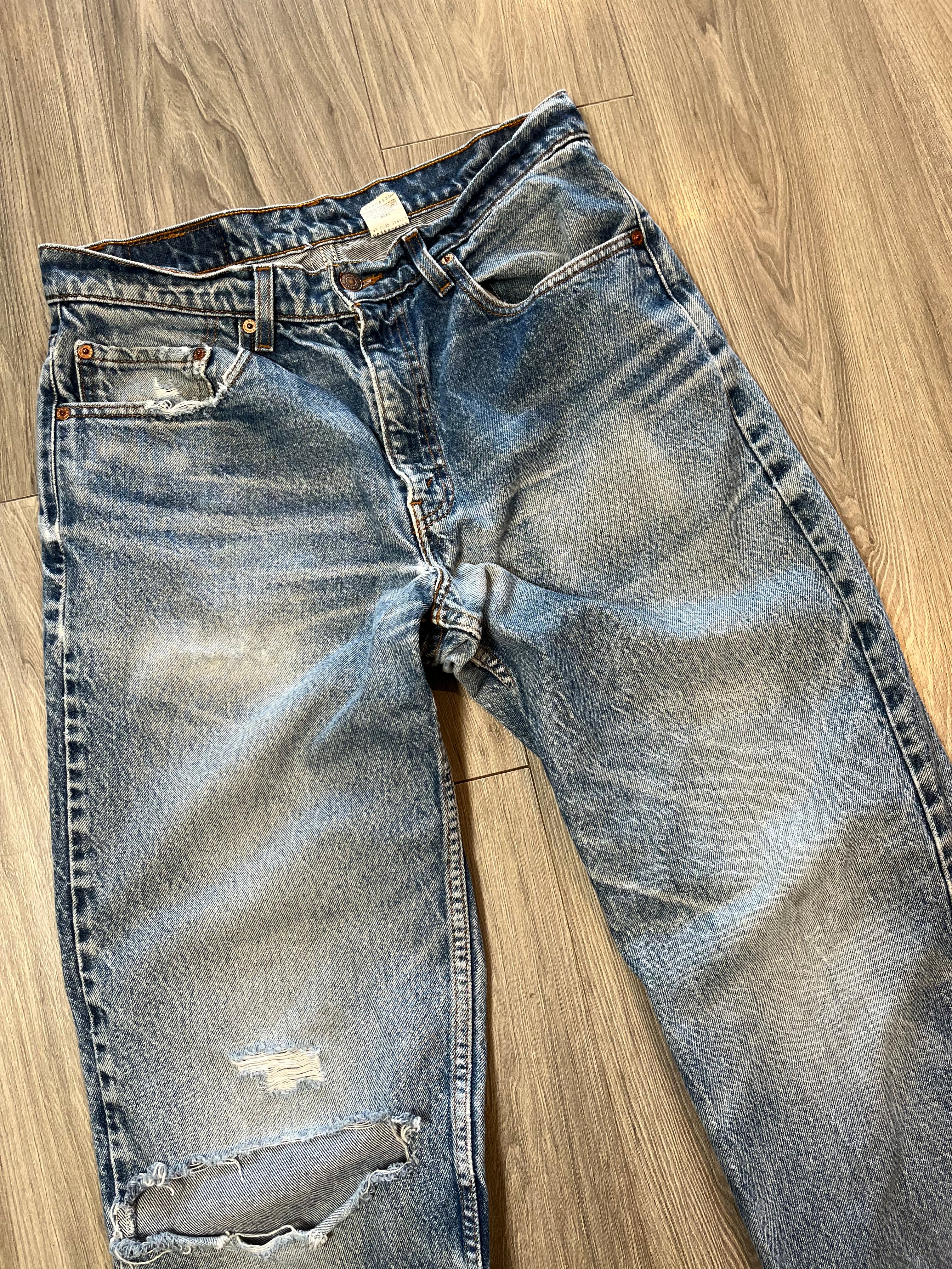Vintage Levi's 550 Medium Wash Distressed Denim 31