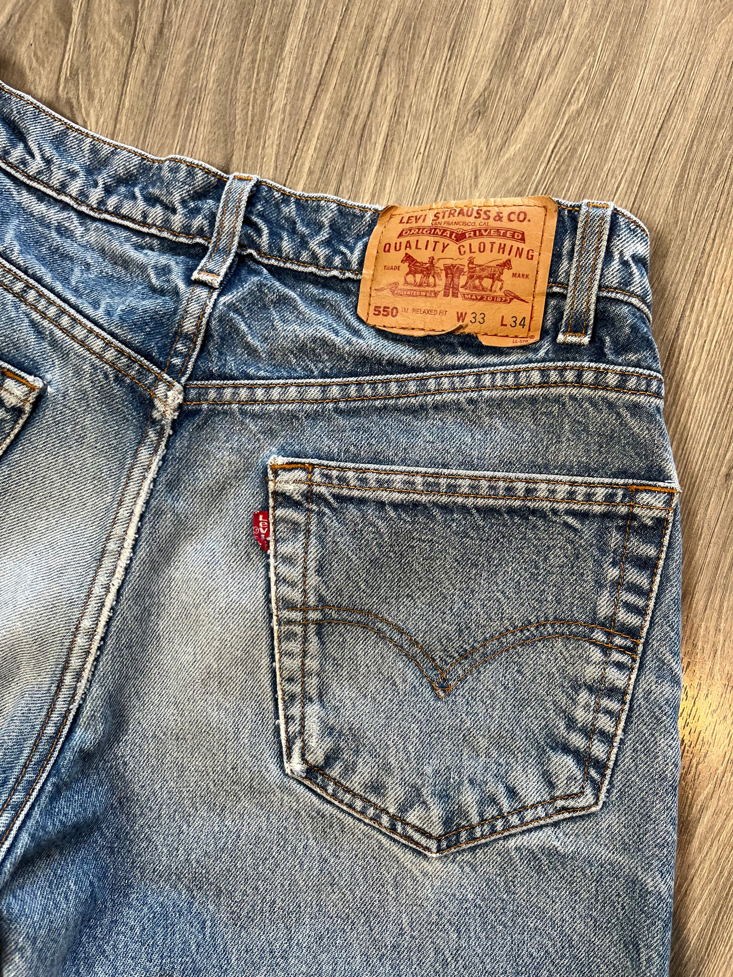 Vintage Levi's 550 Medium Wash Distressed Denim 31
