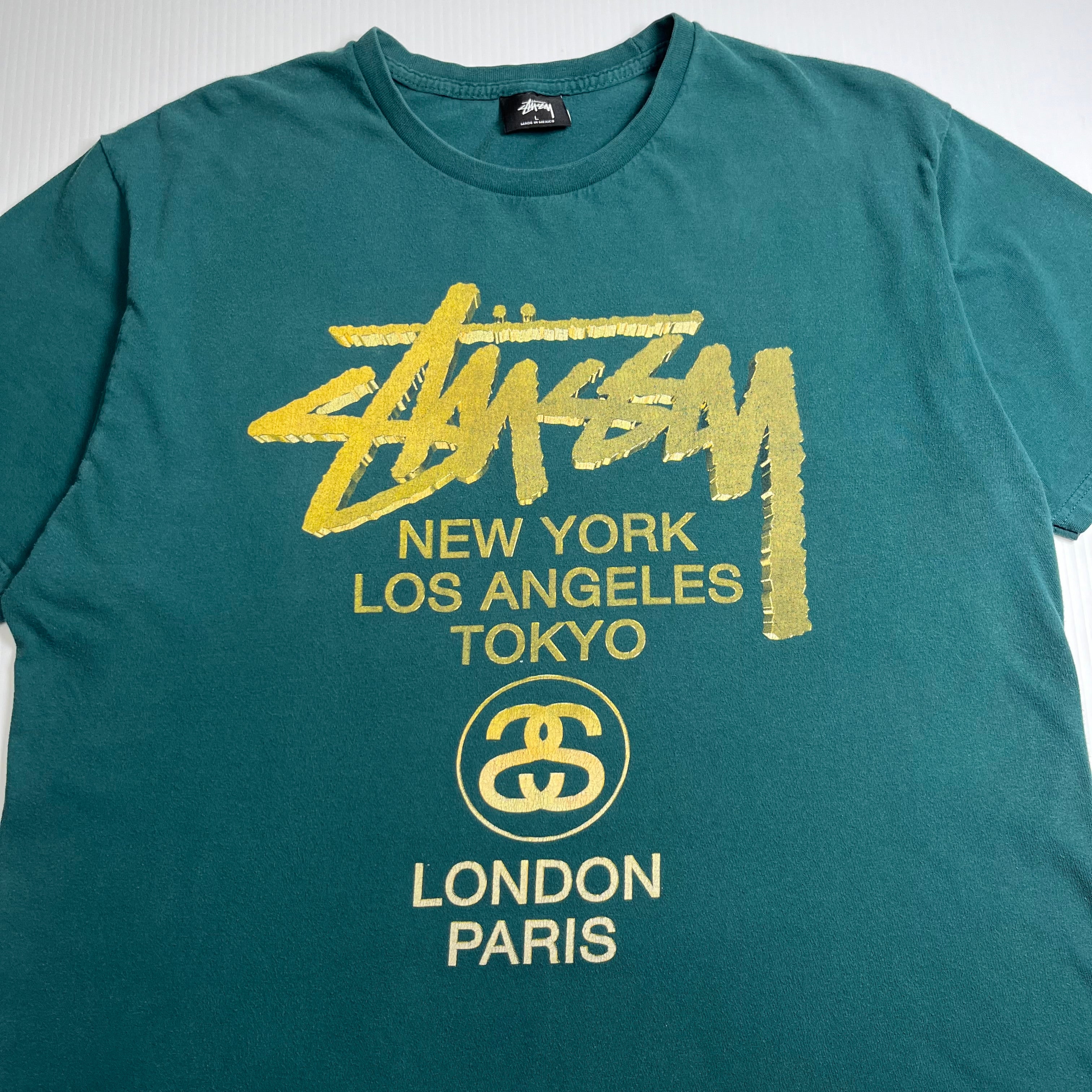 Stussy Gold Text Cities Graphic Tee L
