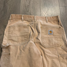 Load image into Gallery viewer, Vintage faded Carhartt Double Knees 36” x 31”
